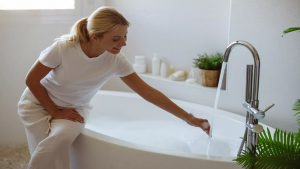 attractive-cheerful-young-woman-pouring-hot-water